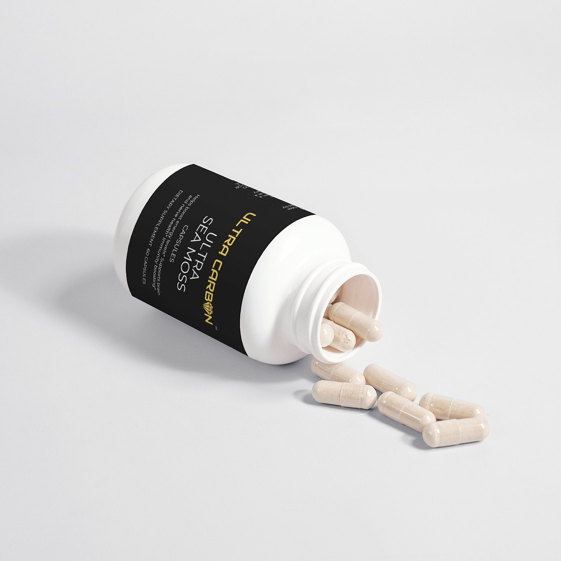 An opened capsule with beige powder spilling out on a white background.